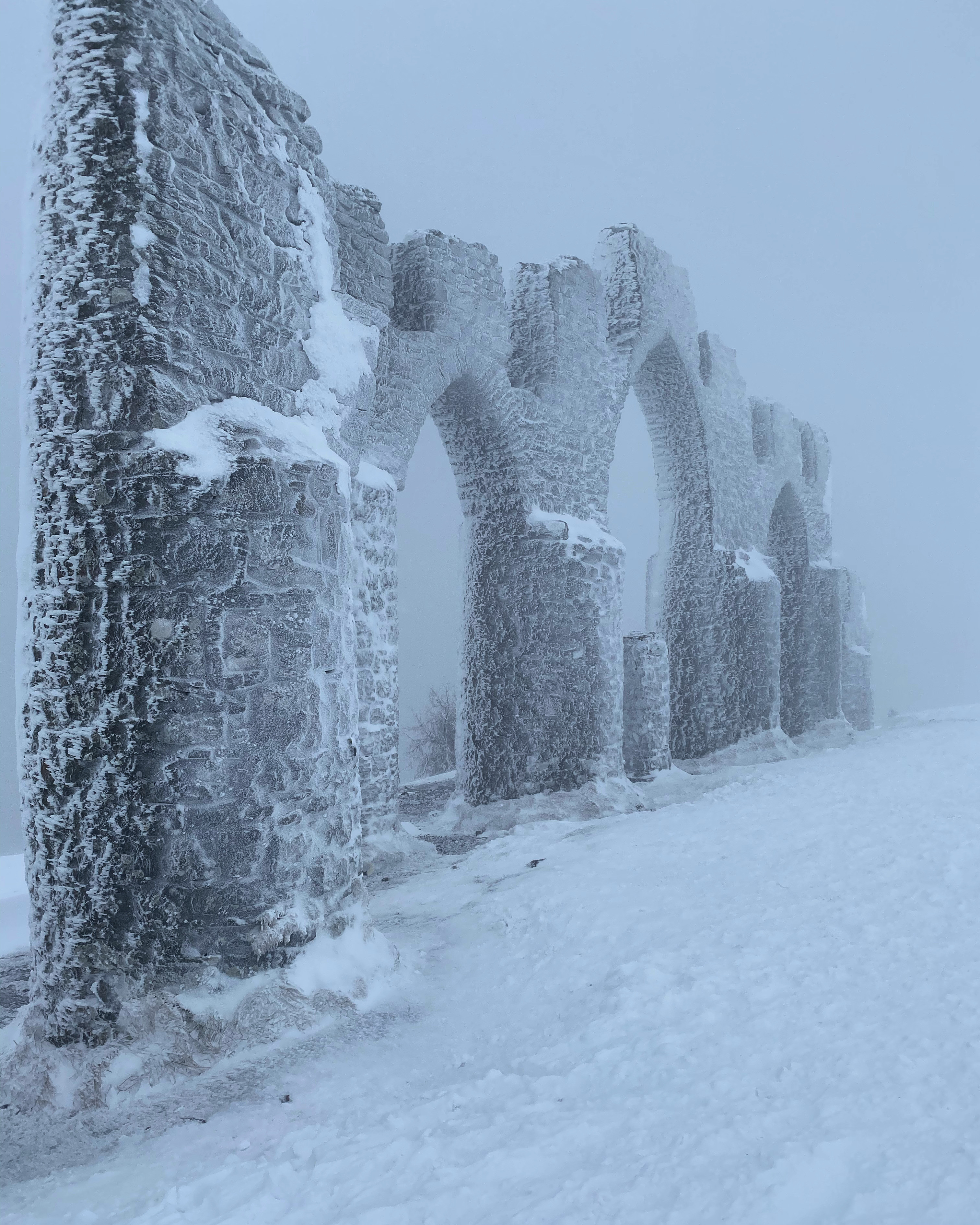 Snow falls on the Fyrish Monument