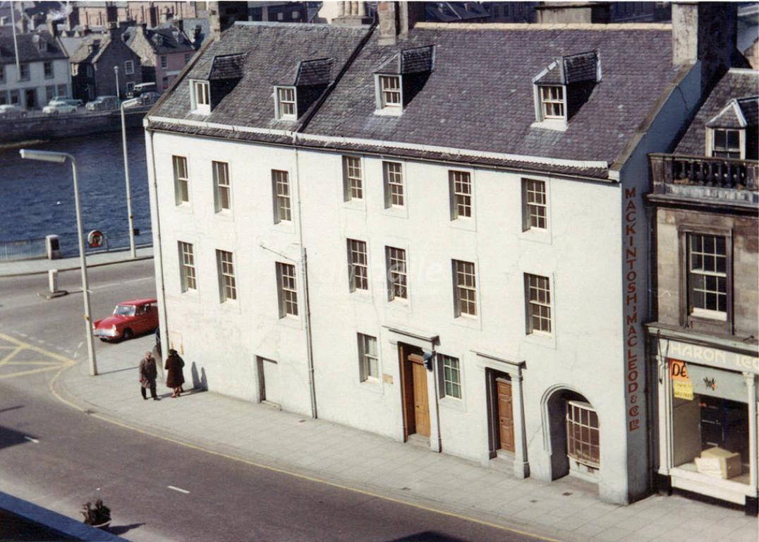 A white building with a grey slate roof on Bridge Street, Inverness in the 1960s. This building was occupied by Mary, Queen of Scots in 1562