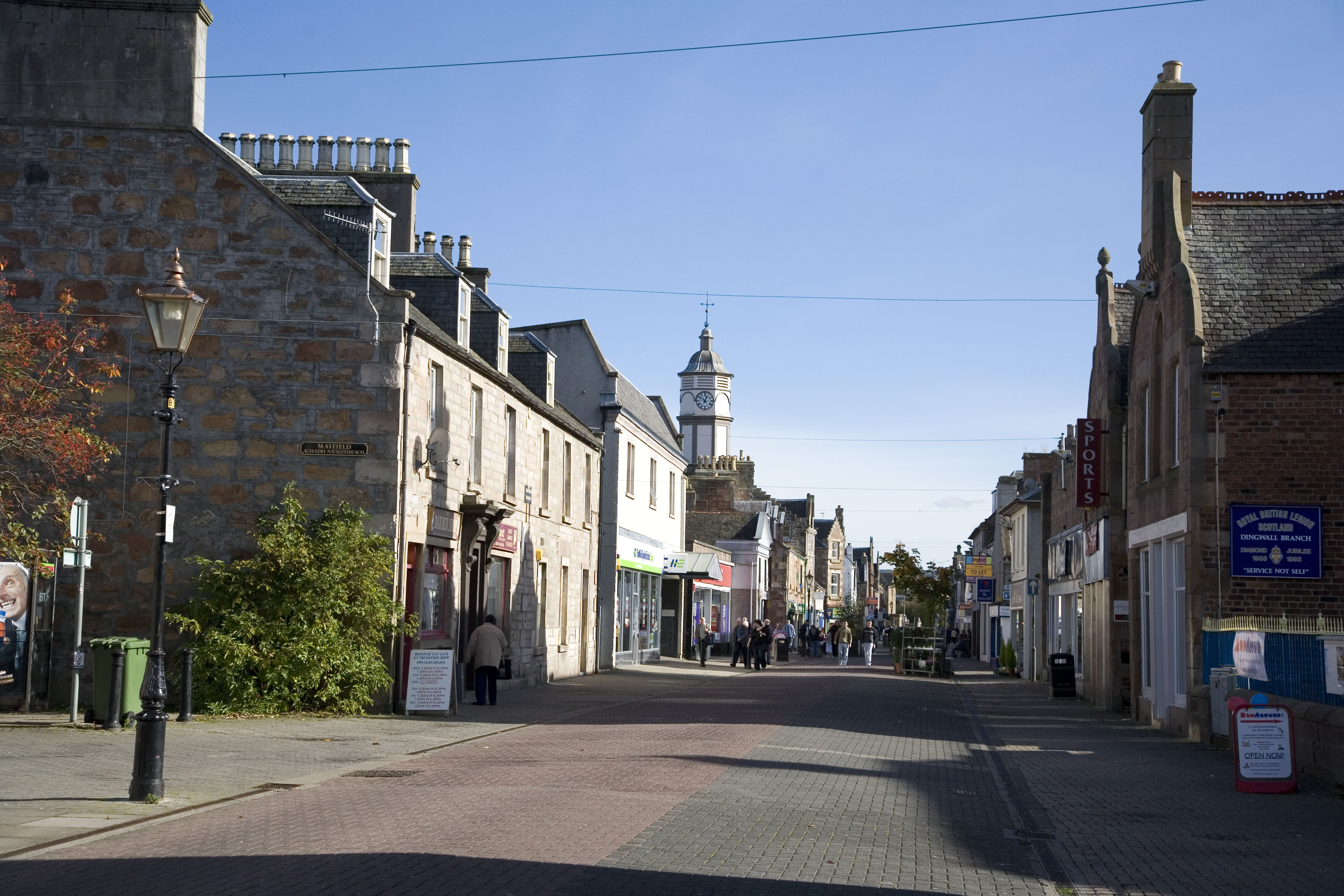 The pedestrianised main street through Dingwall, with the clock tower of the town hall visible