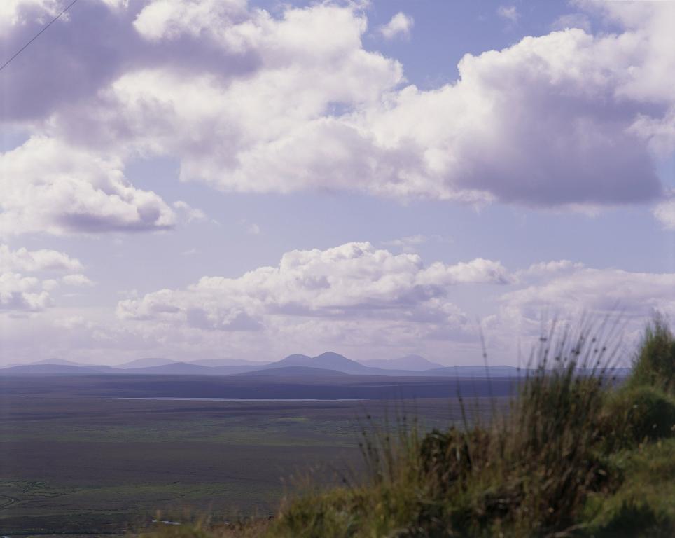 The flat plains of the Flow Country, Caithness under cloudy skies.