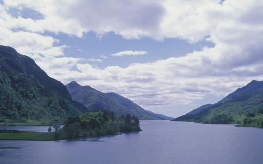 Looking down the length of Loch Shiel, which is flanked by steep hills covered in trees