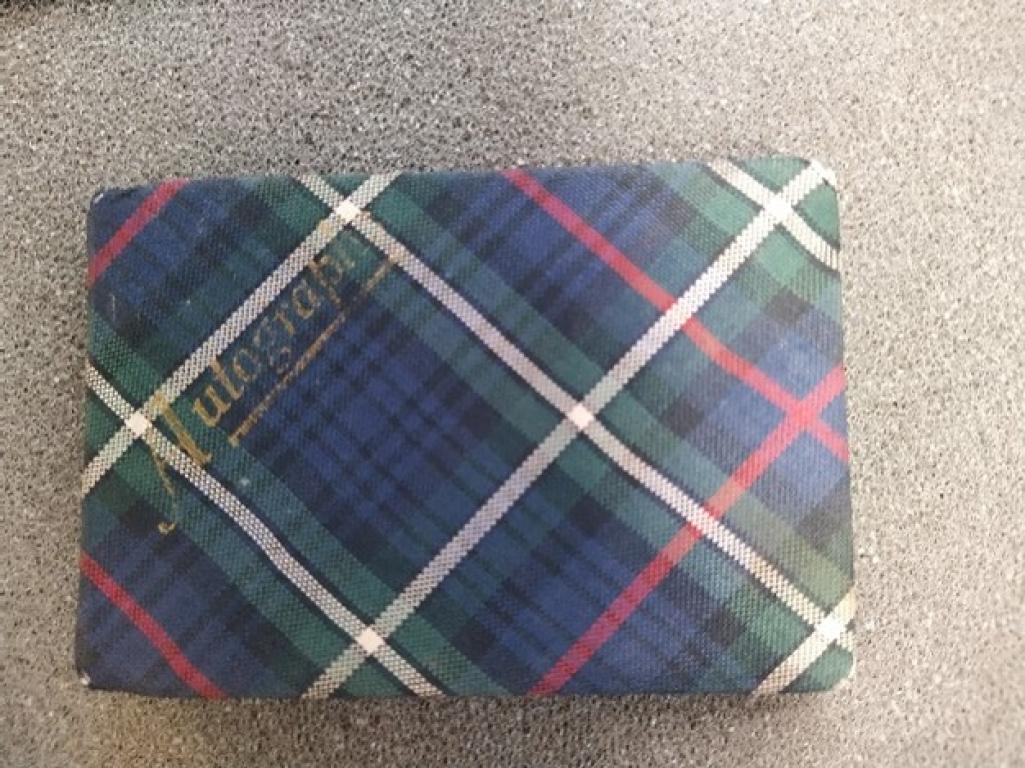 Image of the front of a tartan fabric covered Autograph book.
